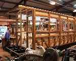 The replica Welshpool and Llanfair bogie carriage taking place in the carriage shops.   (07/08/2003)