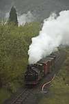 ‘Palmerston’ approaches Stesion Fan with an up train composed of the green small Birminghams.       (30/04/2005)