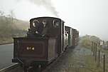 A round or two on the fire before departure, there’s more room in the tender to swing the shovel than on the footplate!       (30/04/2005)