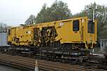 Looking impressive in a Gallic sort of way was the metre gauge tamper awaiting regauging for use on the Welsh Highland phase 4.        (30/04/2005)