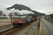 Bottom shunter ‘Palmerston’ with it’s rake of empty slate waggons rolls along the Cob.   (14/10/2005)