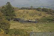 ‘Merddin Emrys’ runs through Dduallt station with the Spooner set (and Moelwyn....)       (15/10/2005)