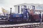 Resident quarry Hunslet ‘Britomart’ at the rear of the stock of the Minffordd shuttle, Harbour station   (02/05/1993)