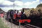 ‘Velinheli’ runs down past the old loco shed at Boston Lodge with a Minffordd shuttle   (02/05/1993)