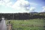 ‘David Lloyd George’ runs across the road at Gwyndy Bank with an up train   (02/05/1993)