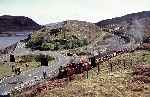 ‘David Lloyd George’ with an up train between the crossings at Tanygrisiau   (02/05/1993)