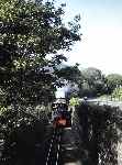 ‘Lilla’ rattles towards Rhiw Plas bridge with the stock of the Minffordd yard shuttle   (03/05/1993)