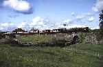 ‘Palmerston’ and ‘David Lloyd George’ cross the road at Gwyndy Bank with the morning up mixed train   (03/05/1993)