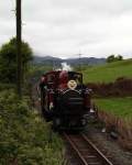 ‘David Lloyd George’ runs light back to Boston Lodge after taking slate wagons up to Dduallt   (05/05/2003)