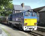 ‘Vale of Ffestiniog’ waits in the down platform at Minffordd   (05/05/2003)