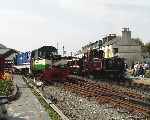 ‘Vale of Ffestiniog’ and ‘Criccieth Castle’ run light into Harbour station from Boston Lodge, ‘Taliesin’ awaits the road.   (01/05/2004)