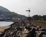 Looking along the Cob towards Porthmadog in late afternoon sunshine.   (01/05/2004)