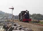 ‘Lilla’ with a Lilla-sized train heads for Minffordd as a change from drive-an-engine at Harbour station.   (01/05/2004)