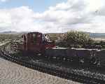 ‘Prince’ awaits departure time with a rake of slate waggons at Harbour station.   (03/05/2004)