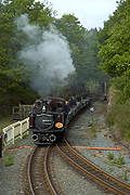 A rake of slate waggons arrives at Tanybwlch behind ‘Merddin Emrys’       (06/05/2007)