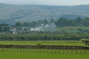 Viewed from the WHR train - ‘Merddin Emrys’ approaches Lottie’s Crossing on the other side of the valley       (07/05/2007)