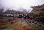 ‘Linda’ and ‘Blanche’ storm round Dduallt Tank Curve with an up train during a gloomy 1997 gala   (03/05/1997)