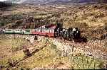 A fine sight!  The two Penrhyn Ladies at Dduallt Tank Curve in the sunshine with an up train   (01/05/1999)