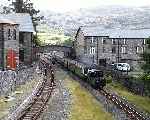 ‘Blanche’ emerges from under the Dorfil footbridge with a train departing from Blaenau Ffestiniog   (18/09/2000)