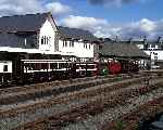 No 18 and the four wheel carriages stand in the sunshine behind Single-Fairlie Taliesin (28/09/2003)