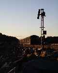 Homeward bound - a train heads towards Porthmadog along the Cob in evening sunshine    (28/09/2003)