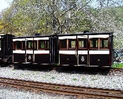 Known as ‘Bug Boxes’, the two 1865 carriages in the Victorian set, nos 2 & 5 stand in the siding at Tanybwlch.   (01/05/2004)