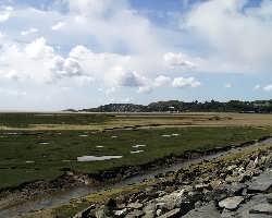 Looking seawards towards Borth-y-Gest as the Talking Train trundles across the Cob.   (03/05/2004)