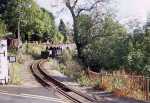 A gravity slate train approaches Penrhyn level crossing   (12/10/2002)