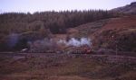 Prince leads a rake of empty slate wagons onto Dduallt tank curve   (12/10/2002)