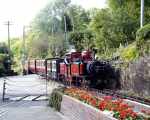 David Lloyd George heads an up train over the level crossing below Penrhyn station   (12/10/2002)