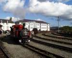 David Lloyd George brings a rake of empty slate wagons into Porthmadog Harbour station   (12/10/2002)