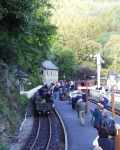 A gravity slate train rolls through a crowded Tanybwlch station   (12/10/2002)