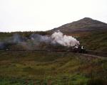 Taliesin and Palmerston take a long rake of empty slate wagons round Dduallt Tank Curve   (13/10/2002)