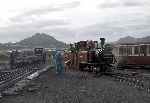 ‘David Lloyd George’ is highlighted by the evening sun as ‘Moelwyn’ shunts slate waggons.   (24/09/2004)