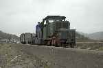 ‘Moelwyn’ drags the temporarily oil-less Simplex back to Boston Lodge along the Cob.   (25/09/2004)