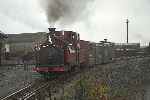 A short train of Small Birminghams, the ‘Flying Flea’ passes Boston Lodge.   (25/09/2004)