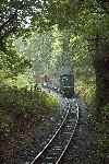 ‘Moelwyn’ worked rake of slate waggons to Tan-y-Bwlch, seen here at on Gysgfa curves.   (25/09/2004)