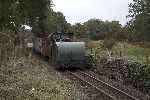 The two WW1 tractors brought the slate waggons back to Port, here seen at Bron Turner crossing, Minffordd.   (25/09/2004)