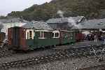 After setting back from Boston Lodge Halt, Prince and train briefly ended up looking rather out of place in Boston Lodge yard.   (26/09/2004)