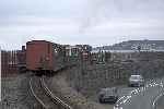 The chain shunt over, ‘Prince’ propels the carriages around the curve towards Boston Lodge Halt.   (26/09/2004)