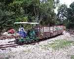 A Lister Rail Truck with a rather fetching canopy runs into the yard with a rake of peat wagons   (07/09/2003)