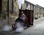 Hunslet 18 inch gauge 0-4-0WT ‘Jack’ runs between the mill buildings at Armley.   (19/04/2003)