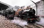 4-8-2 No 5 ‘Hercules’ leaves New Romney, passing 4-6-2 No 2 ‘Northern Chief’ in the adjoining platform   (07/08/1982)