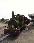 Dolgoch bedecked with flags and headboard with the Golden Jubilee departure at Tywyn Wharf (29/07/2001)