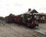 Dolgoch bedecked with flags and headboard with the Golden Jubilee departure at Tywyn Wharf (29/07/2001)