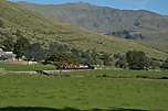 K1 crosses the fields past Castell Cidwm with Snowdon in the background.       (08/09/2006)