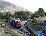 Departing from Waunfawr, ‘Caernarfon Castle’ uses the new platform face   (26/09/2003)