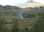 Viewed from the village below, ‘Prince’ runs around the curves at Ffridd Isaf.       (16/09/2005)
