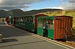 The vintage train caught in the sun at Rhyd Ddu, Nos 1, 23 and Van 2.       (16/09/2005)