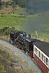 143 emerges from under the A4085 at Castell Cidwm with a down train.        (17/09/2005)